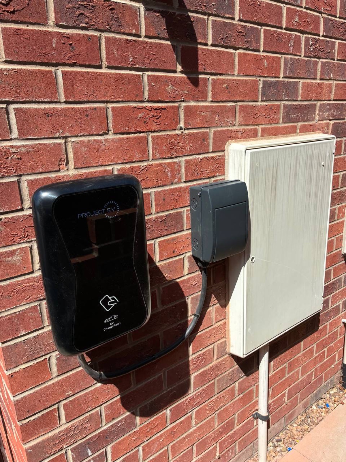 Project EV charger installed on red brick wall in Derby